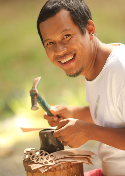 Hariyono crafting his leather jewelry